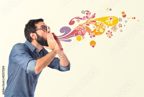 Young hipster man shouting over white background