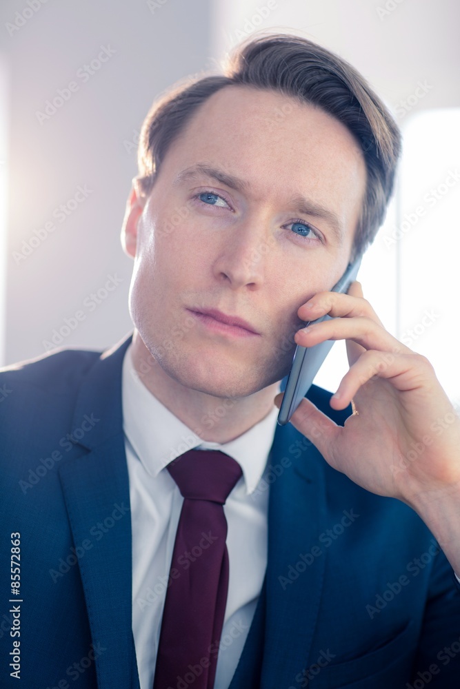 Serious businessman having a phone call Serious businessman having a phone call