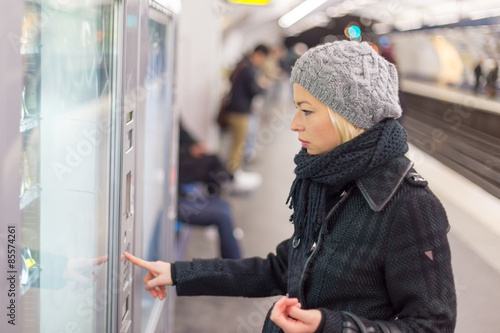 Lady buying ticket for public transport. photo