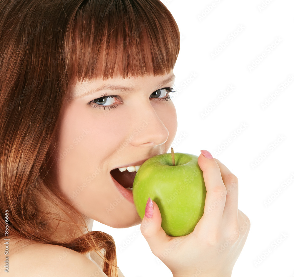 woman eating a green apple isolated over white woman eating a green apple isolated over white