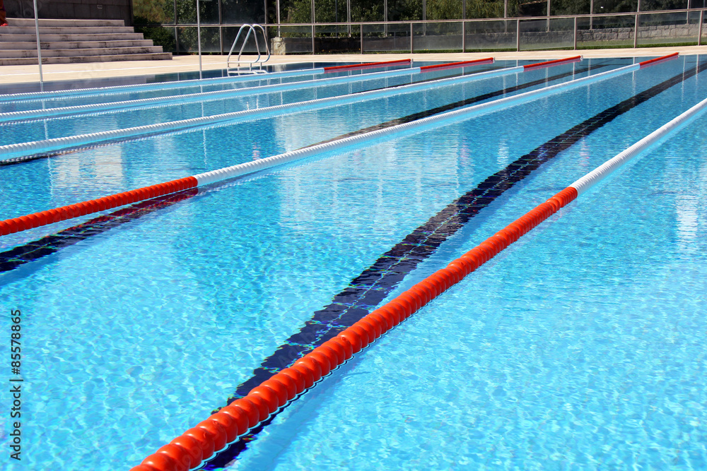 View of lane rope in an outside Olympic pool.