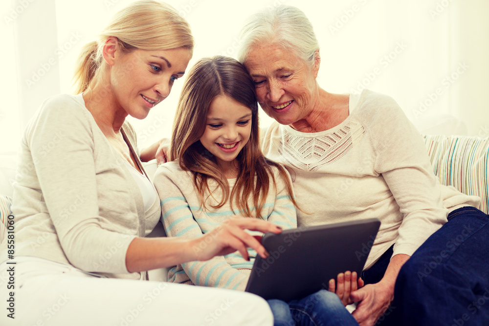 smiling family with tablet pc at home