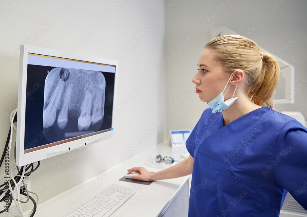 dentist with xray on monitor at dental clinic Stock Photo Adobe Stock