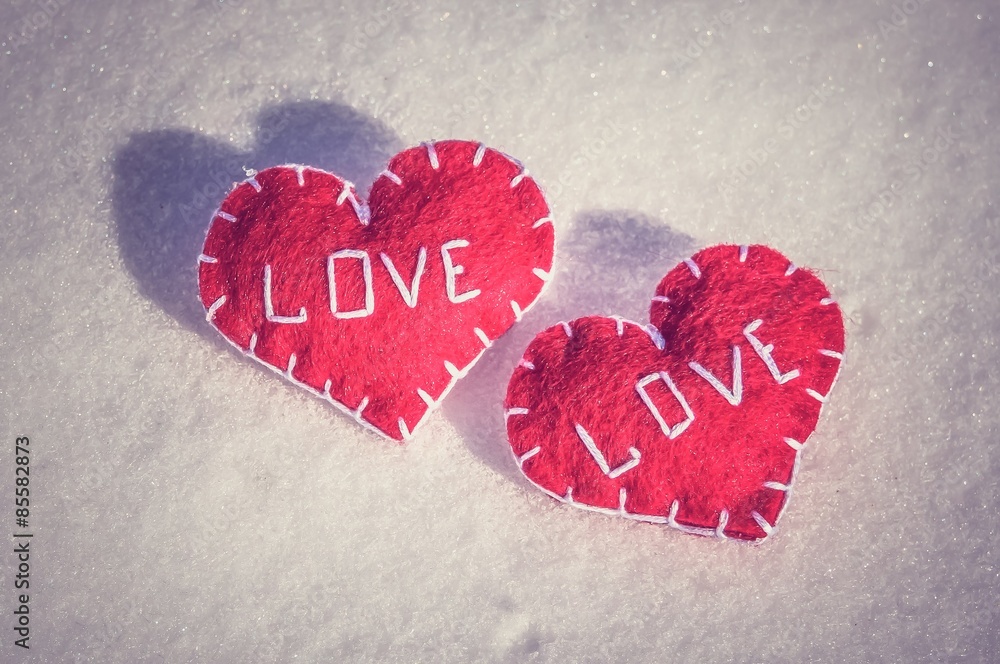 Fototapeta premium Beautiful hearts on a snow backgroud