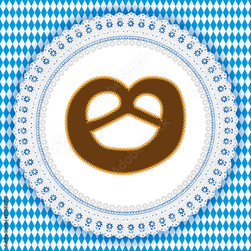 White lace doily with pretzel on a german Oktoberfest background