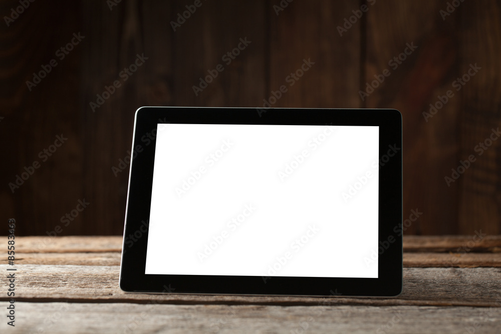 digital tablet computer with isolated screen over old grey wooden background table digital tablet computer with isolated screen over old grey wooden background table