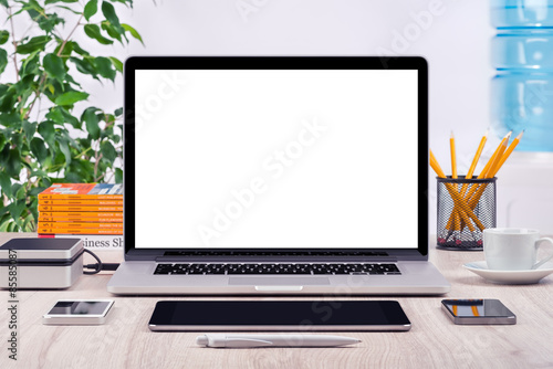 Workplace with open laptop mockup different gadgets 
