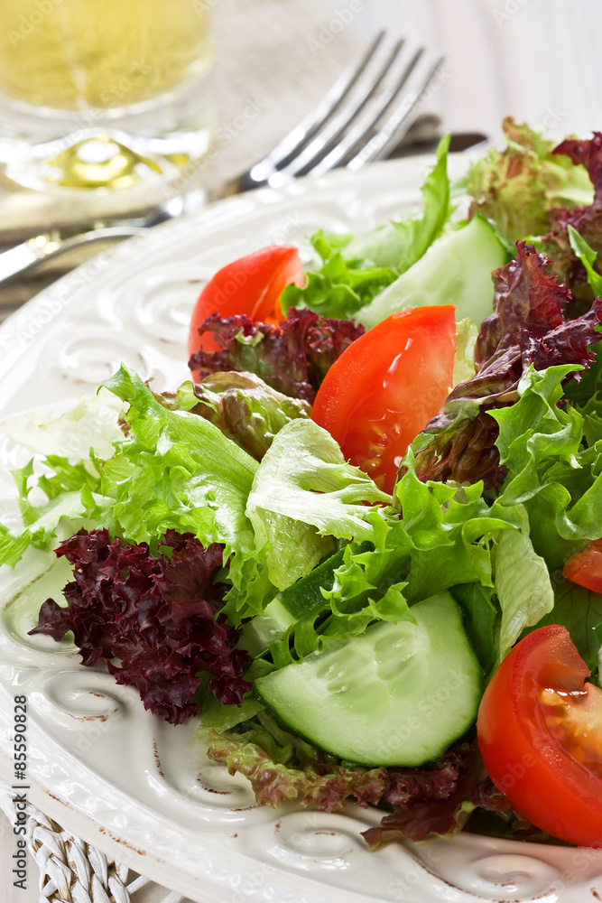Salad / Fresh salad with green, red lettuce, tomato and cucumber Salad / Fresh salad with green, red lettuce, tomato and cucumber
