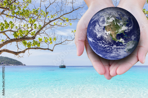 фотографія the planet among human hands in concept  Healthy oceans  healthy