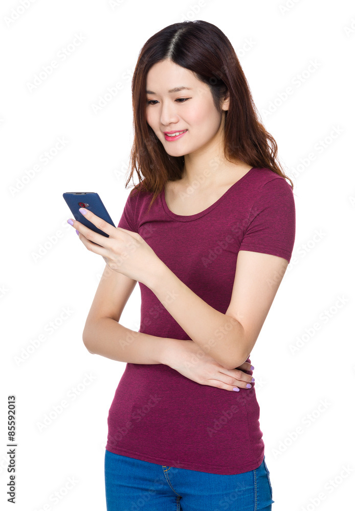 Fototapeta premium Young woman use of mobile phone
