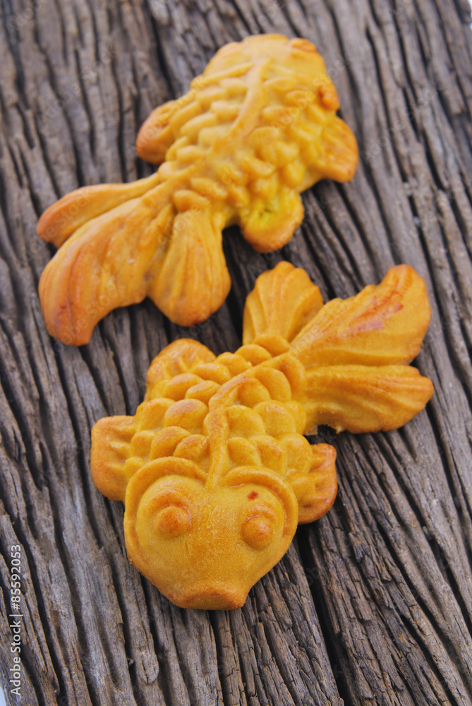Moon cake in gold fish shape or Chinese cake mung bean Moon cake in gold fish shape or Chinese cake mung bean