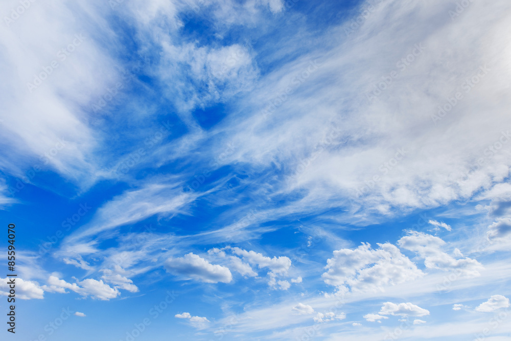 Horizontal image of white clouds on blue spring sky background Horizontal image of white clouds on blue spring sky background