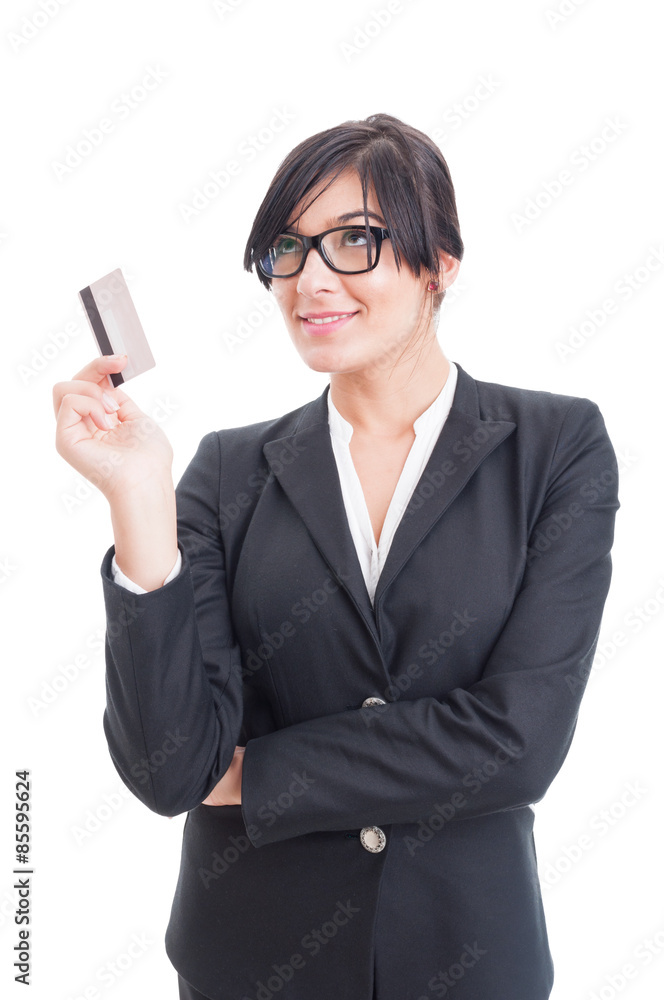 Woman holding credit card and thinking at shopping Woman holding credit card and thinking at shopping
