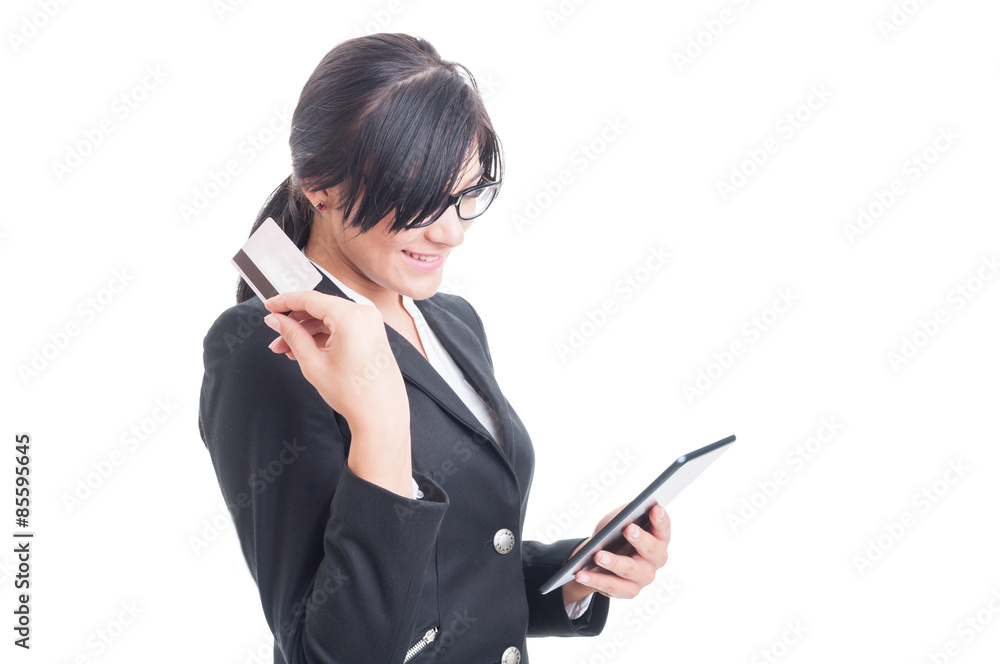 Elegant woman holding tablet and credit card Elegant woman holding tablet and credit card