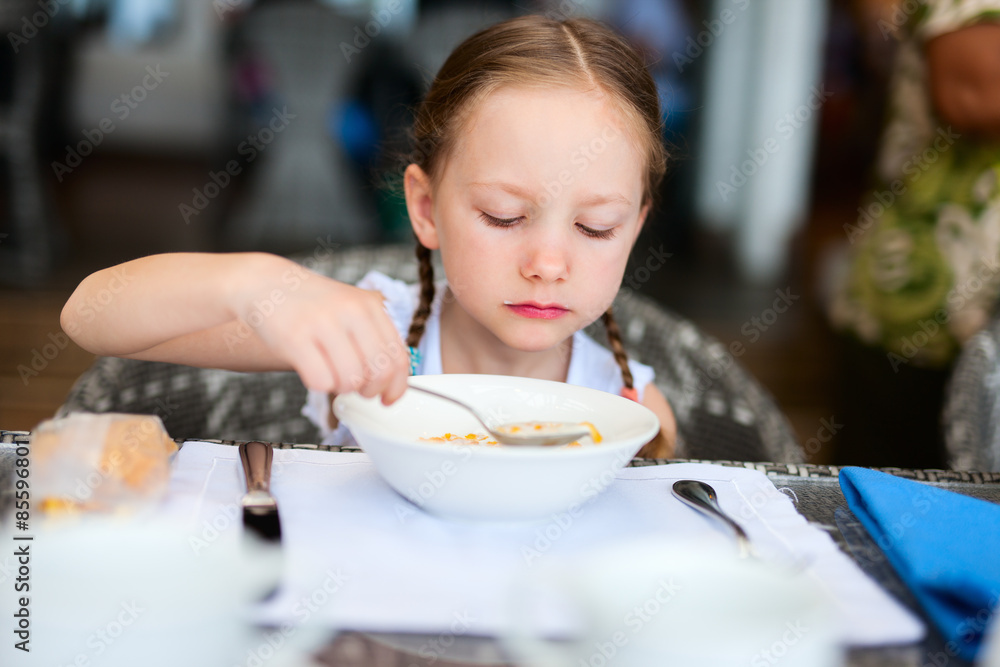 Little girl eating breakfast Little girl eating breakfast