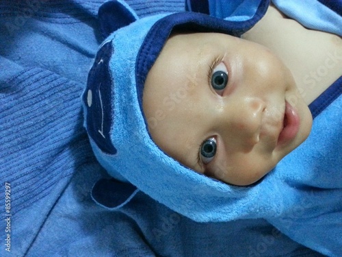 Baby boy with blue bear hood