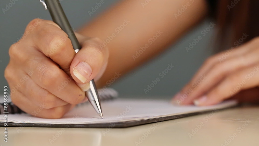 panning shot of hand writing on the paper panning shot of hand writing on the paper