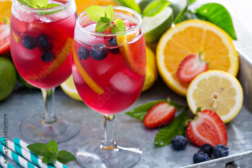 Ice cold red sangria with citrus fruits