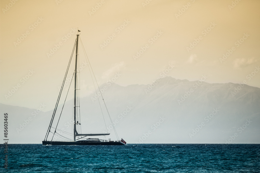 Sailboat floating on quiet sea