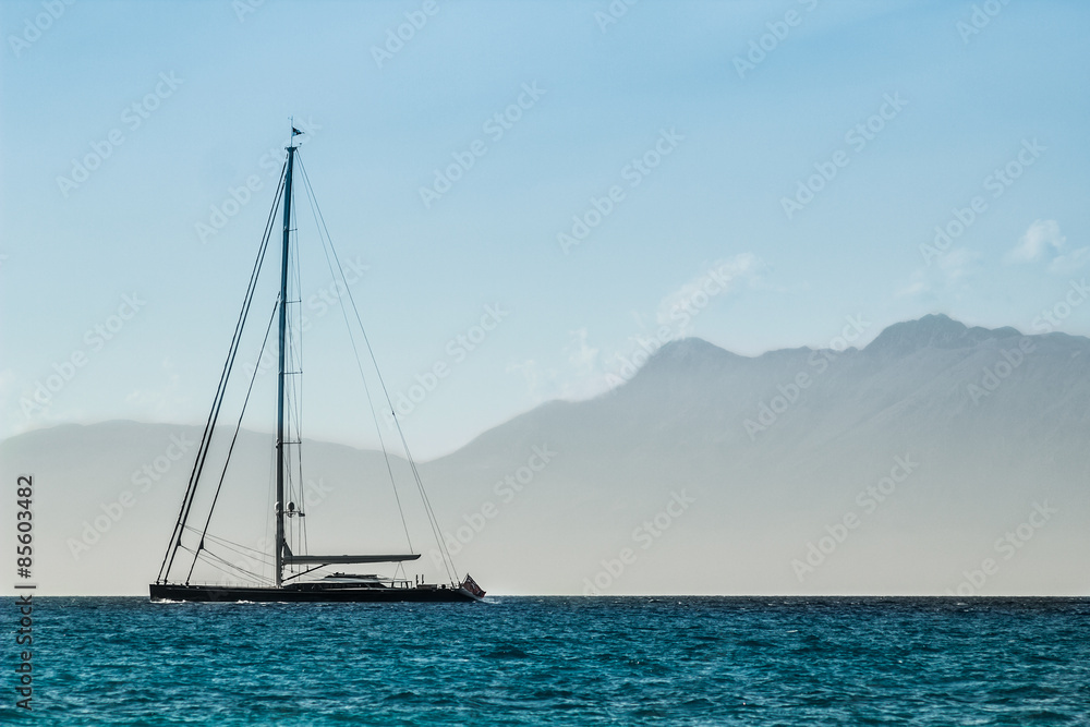 Sailboat floating on quiet sea