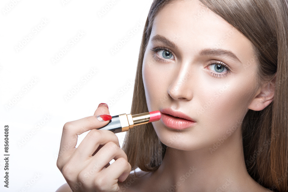 Charming young babe with lipstick and light makeup. Picture taken in the studio.Beauty face Charming young babe with lipstick and light makeup. Picture taken in the studio.Beauty face