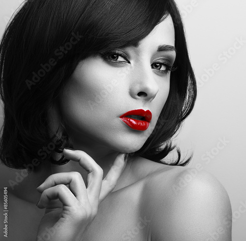 Beautiful short hair style woman with red lips looking sexy. Bla
