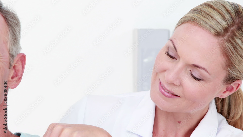 Doctor examining her patient back Doctor examining her patient back