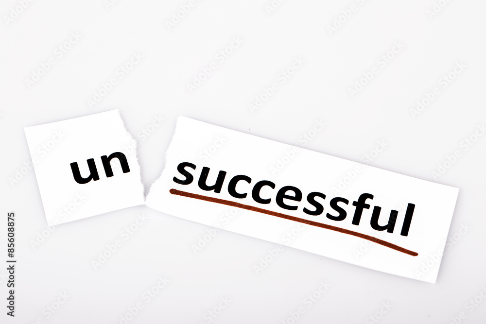 The word unsuccessful changed to successful on torn paper The word unsuccessful changed to successful on torn paper