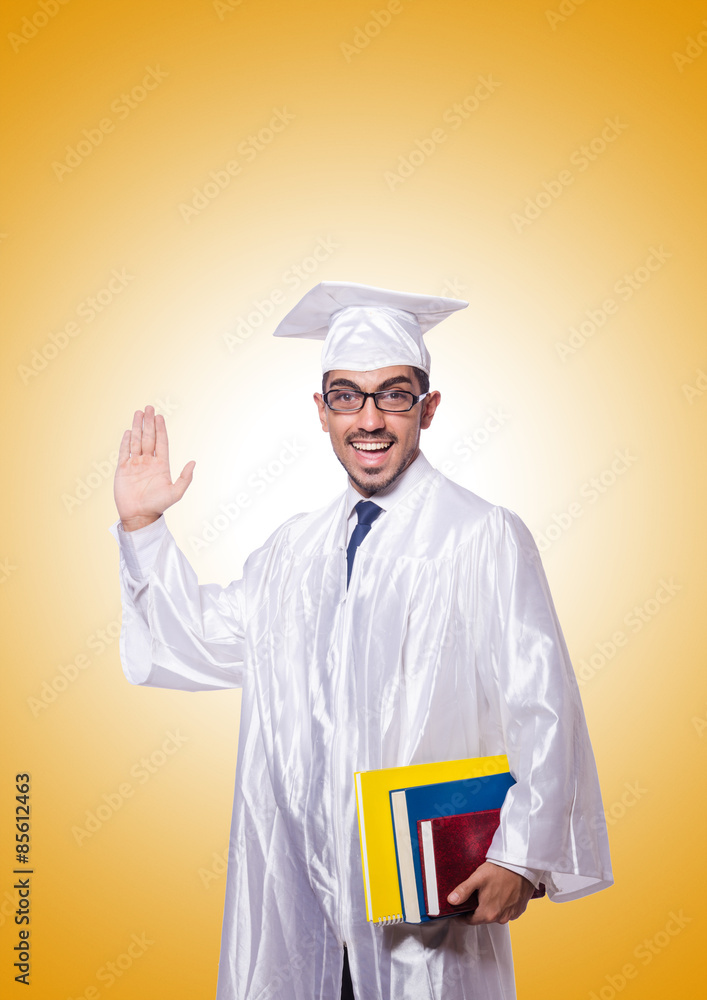 Young male student against the gradient Young male student against the gradient