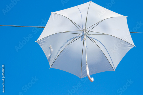White umbrellas canes in the sky
