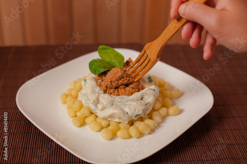 Gnocchi and spinach. photo