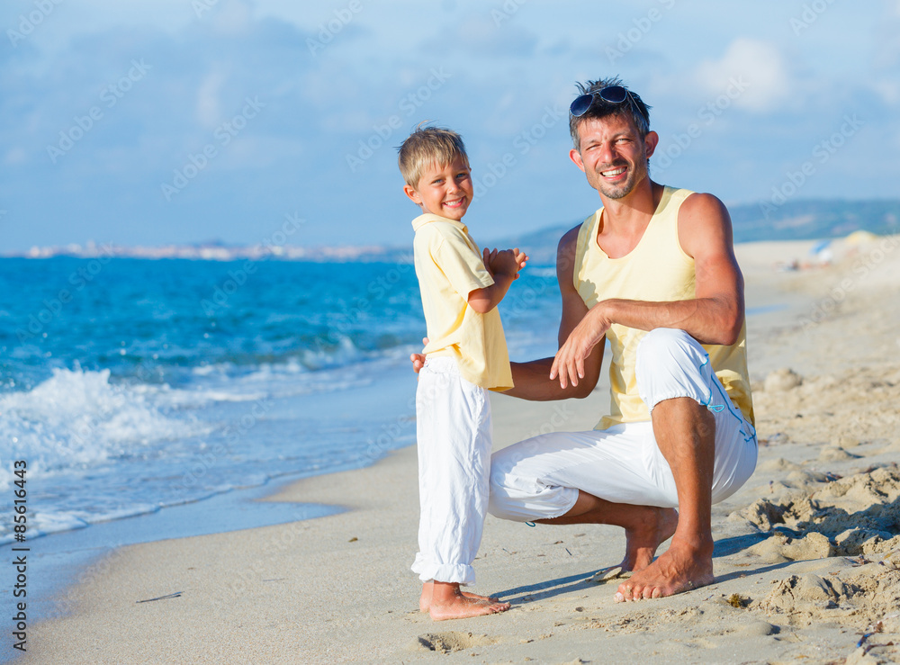 Fototapeta premium Father and son on beach