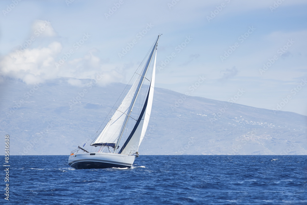 Wind in yacht sails with beautiful sky. Luxury yachts.