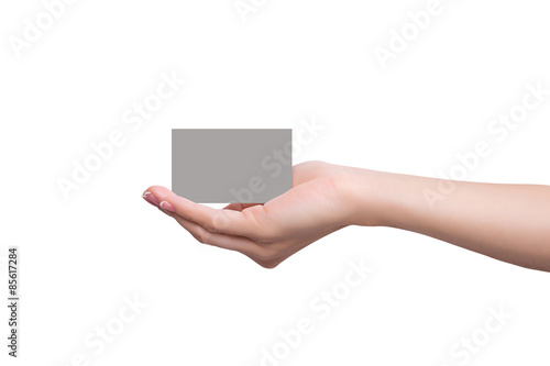 Business card lays on a female hand