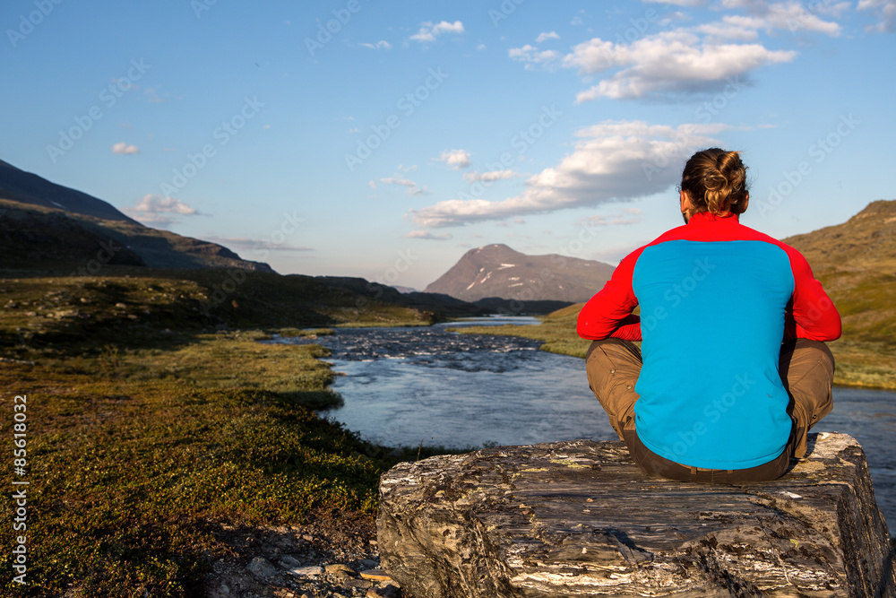 relaxing in the evening sun in the wilderness of northern sweden relaxing in the evening sun in the wilderness of northern sweden