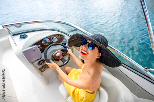 Woman driving yacht