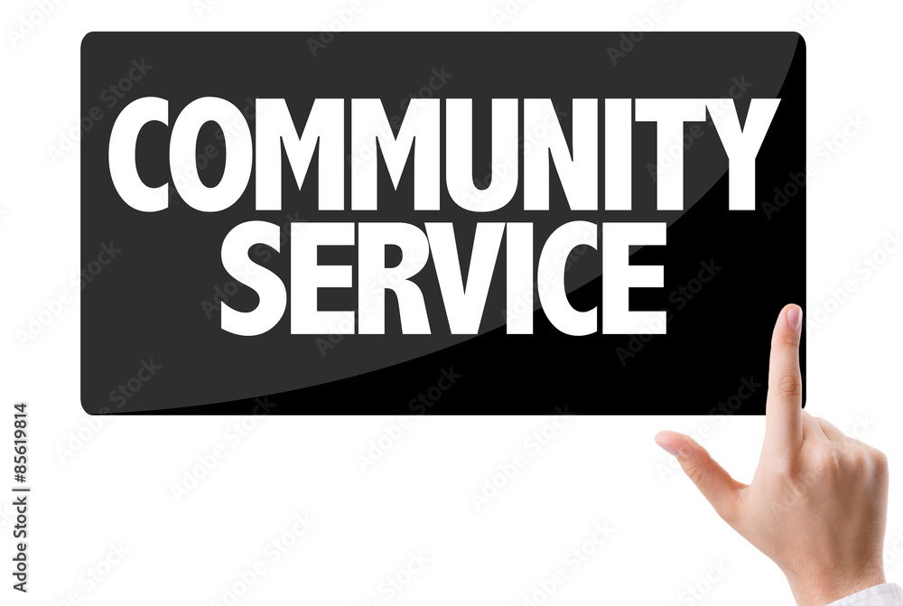 Businessman pressing button with the text: Community Service Businessman pressing button with the text: Community Service