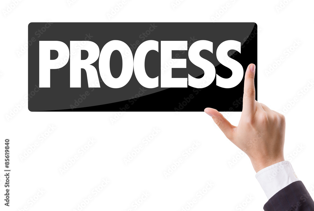 Businessman pressing button with the text: Process Businessman pressing button with the text: Process