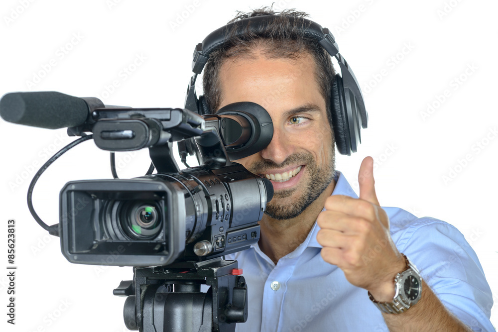 a young man with professional movie camera