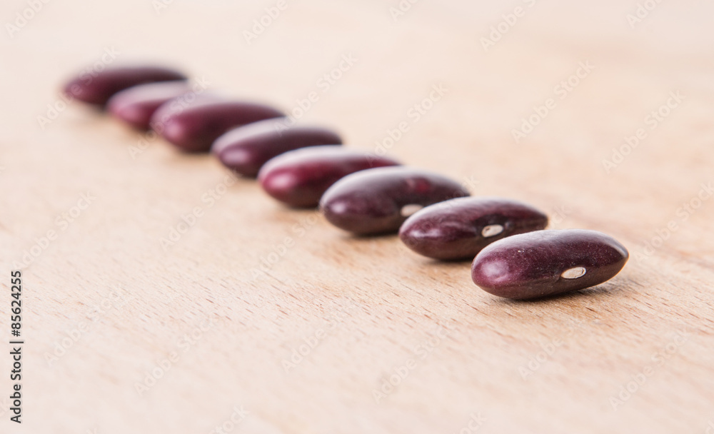 Red kidney beans on wooden background Red kidney beans on wooden background