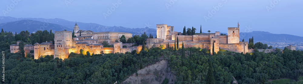 Granada - panorama of Alhambra palace at dusk.
