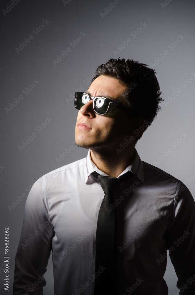 Young man in cool sunglasses isolated on gray Young man in cool sunglasses isolated on gray