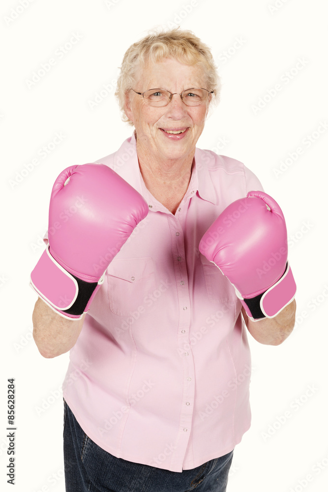 Portrait of grandmom wearing pink boxing gloves isolated on white Portrait of grandmom wearing pink boxing gloves isolated on white