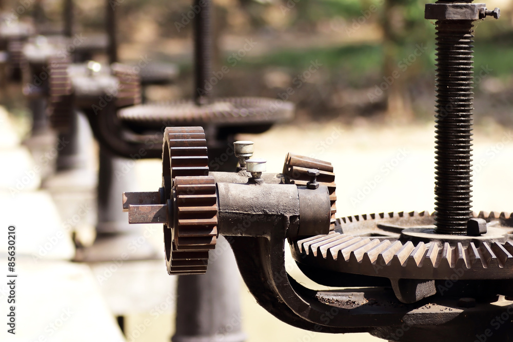 close-up mechanical gear with a large toothed wheel of Floodgate close-up mechanical gear with a large toothed wheel of Floodgate