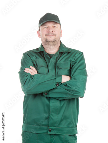 Worker in green overalls. 