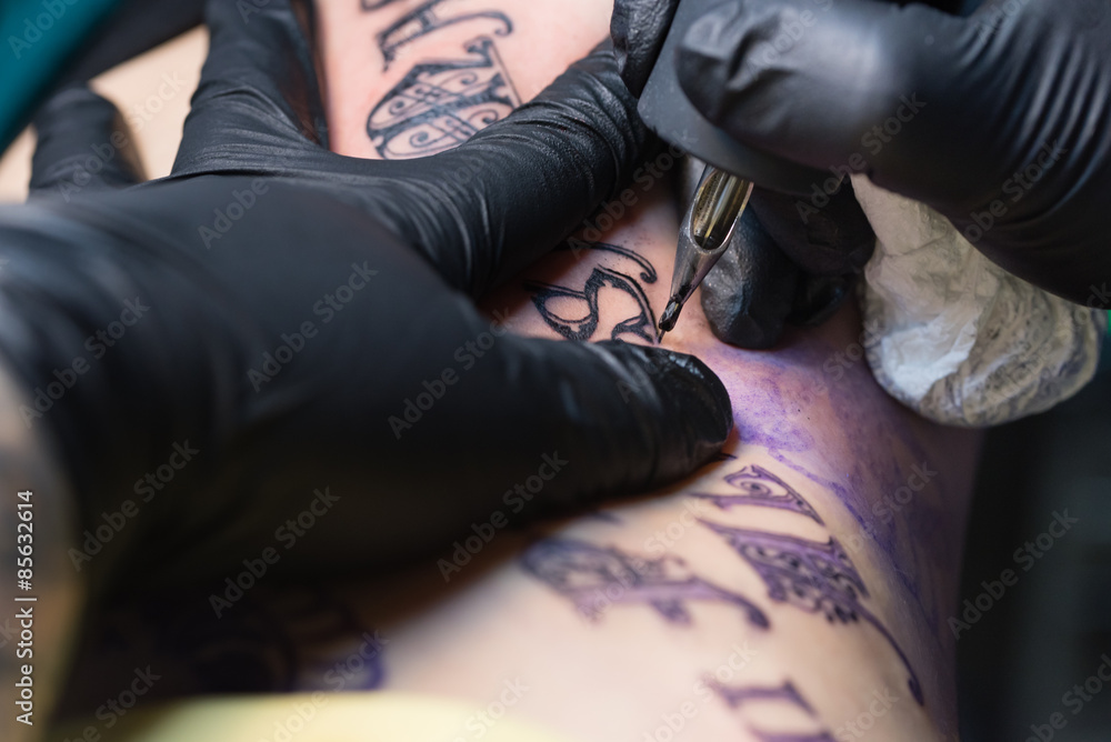 Fototapeta premium Girl Getting Tattoo