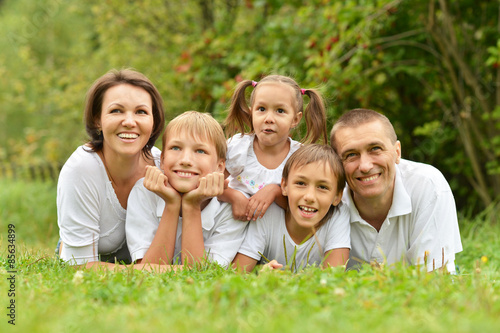 Family of five lying 