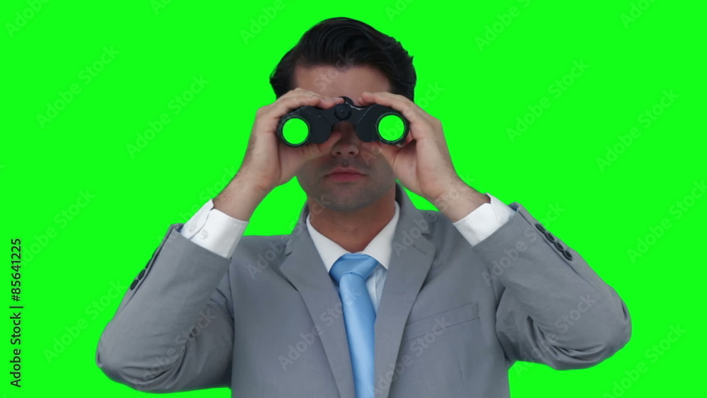 Businessman looking through binoculars Businessman looking through binoculars