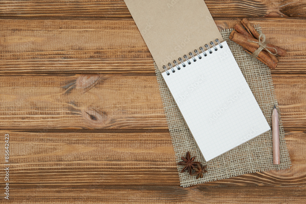 Blank notepad for copy space and herbs on wooden table Blank notepad for copy space and herbs on wooden table