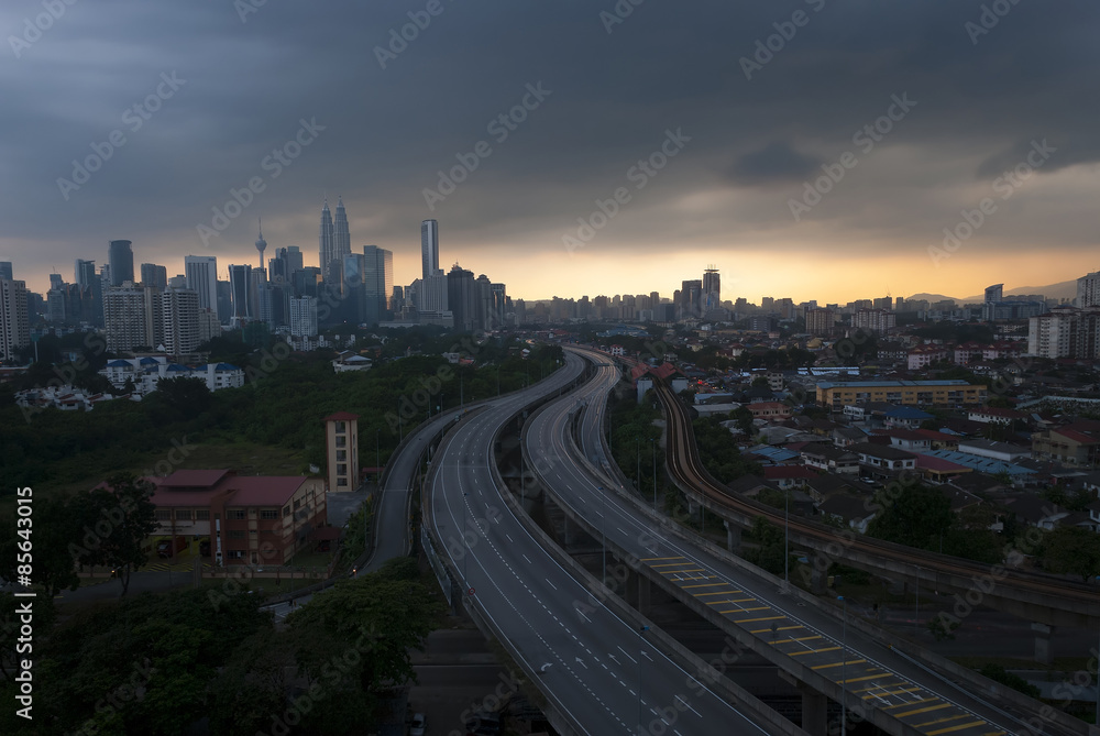 scenery of elevated highway heading towards Kuala Lumpur city centre during sunset